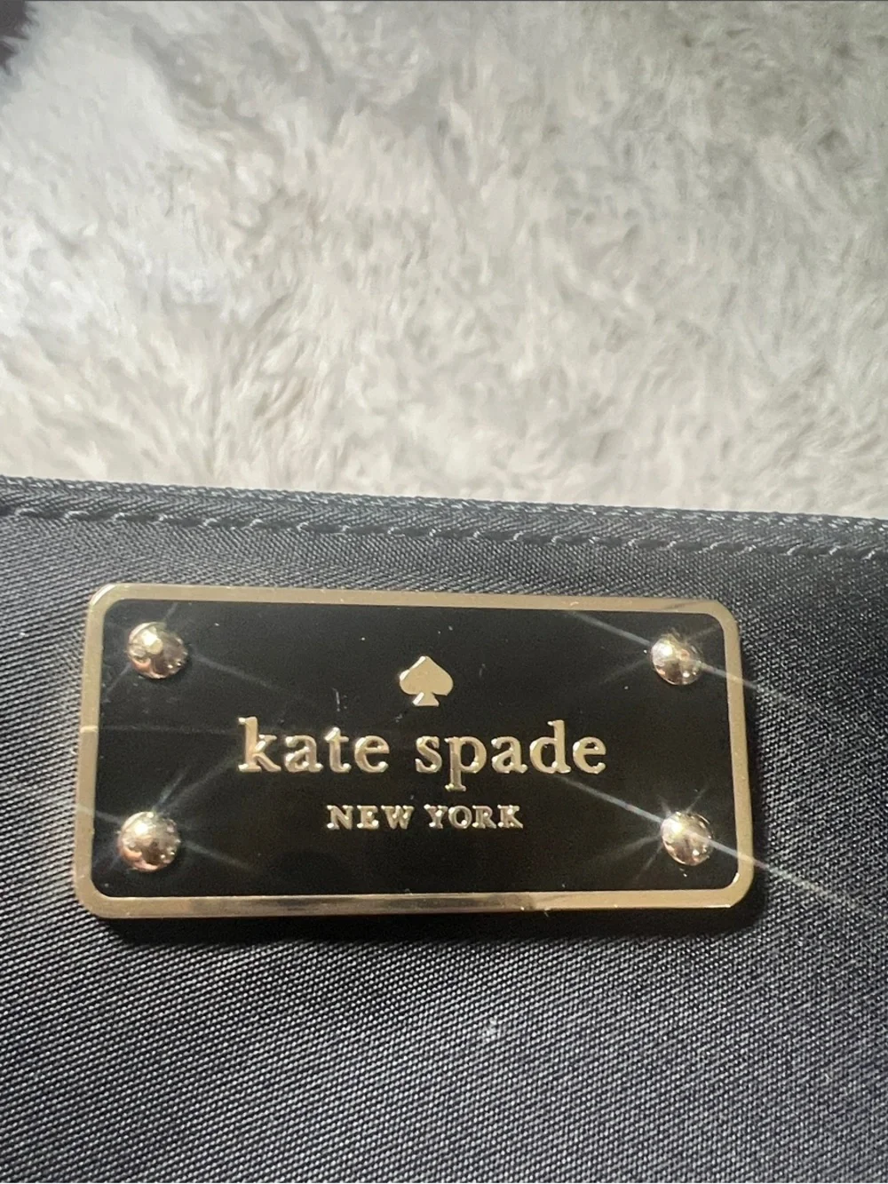 kate spade Black Zip-Around Logo Plate Wallet